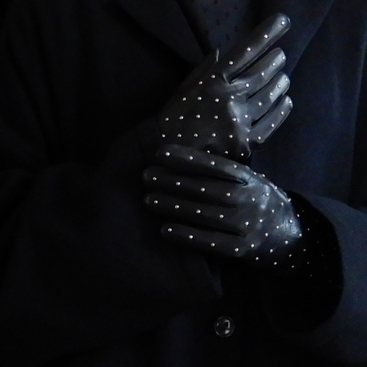 Silk-lined studded leather gloves in Black