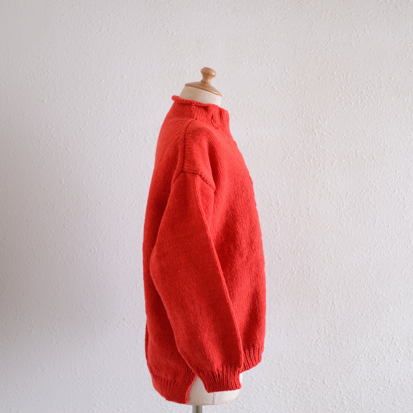 Wool hand knitted cable cardigan in red