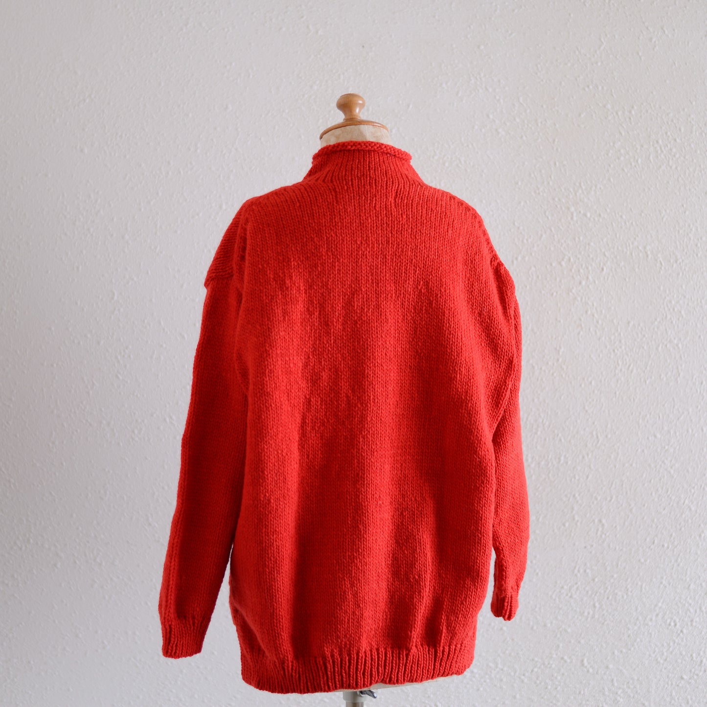 Wool hand knitted cable cardigan in red