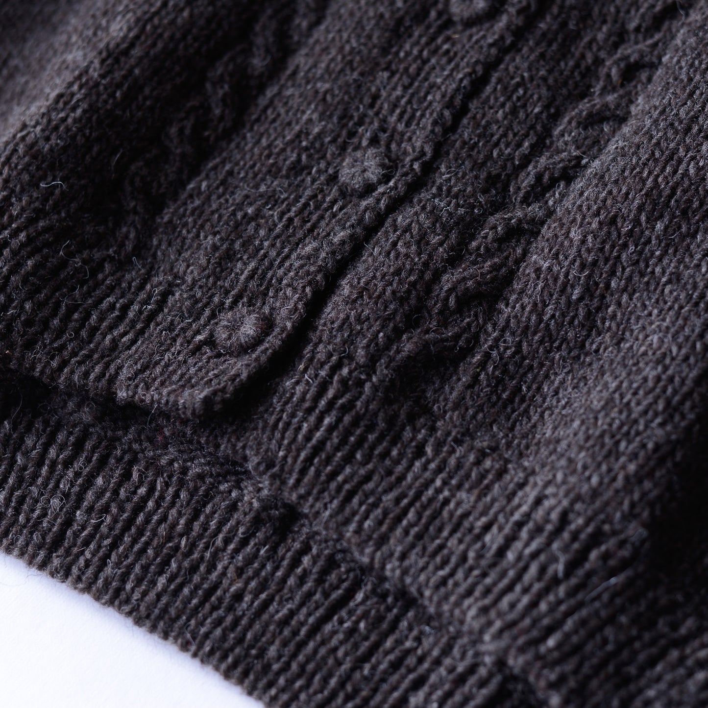 Wool hand knitted cable cardigan in brown