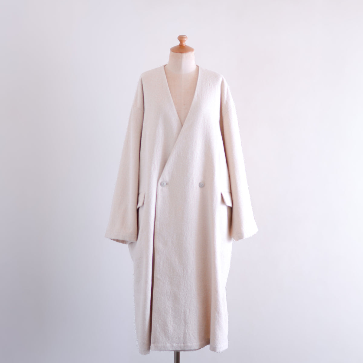 Soft wool collarless coat in Black