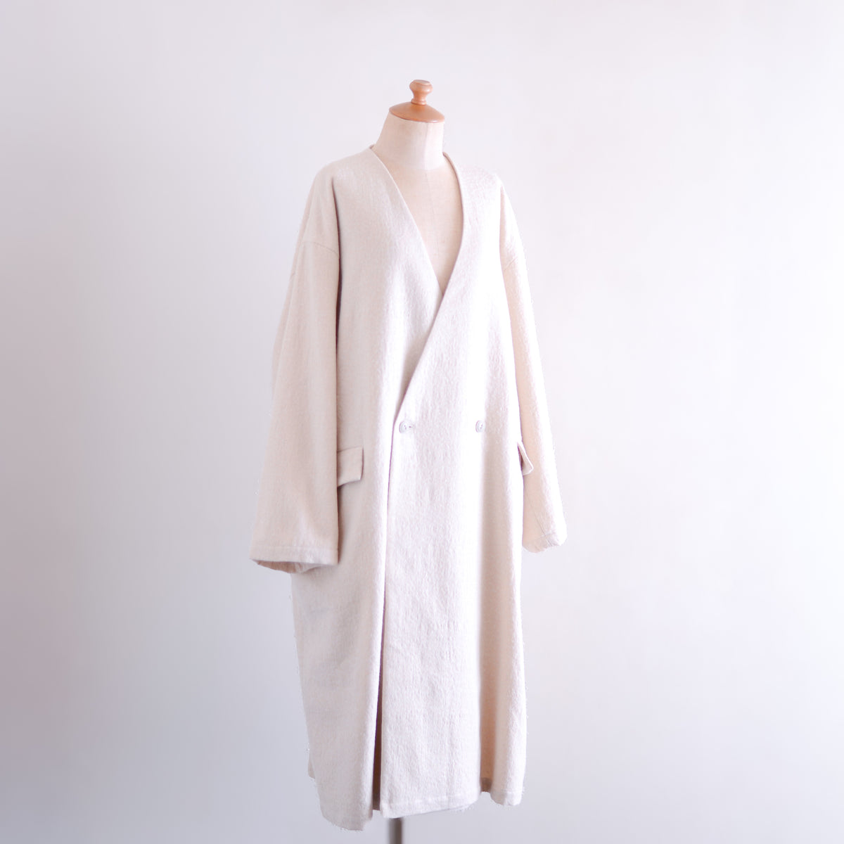 Soft wool collarless coat in Black