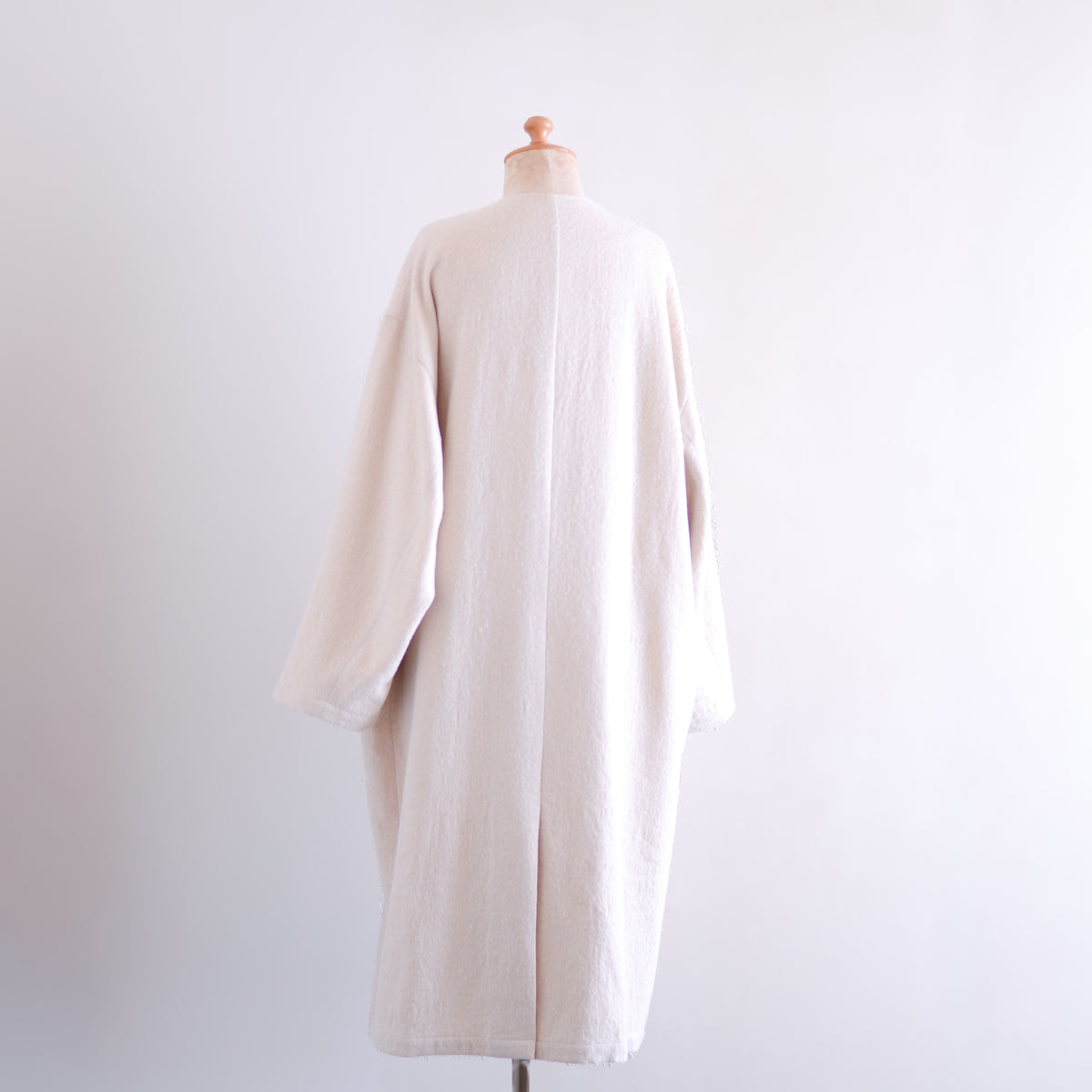 Soft wool collarless coat in Black
