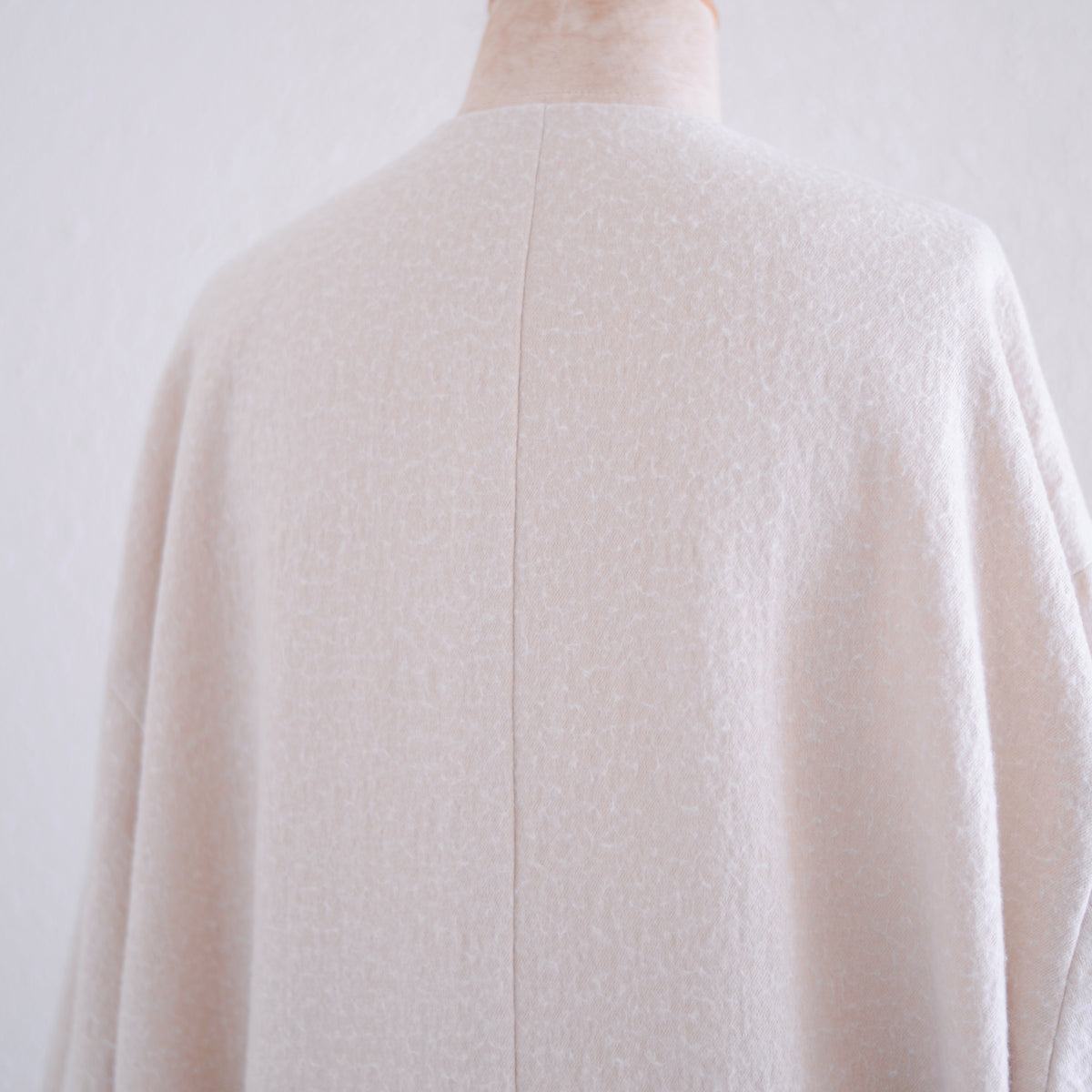 Soft wool collarless coat in Black