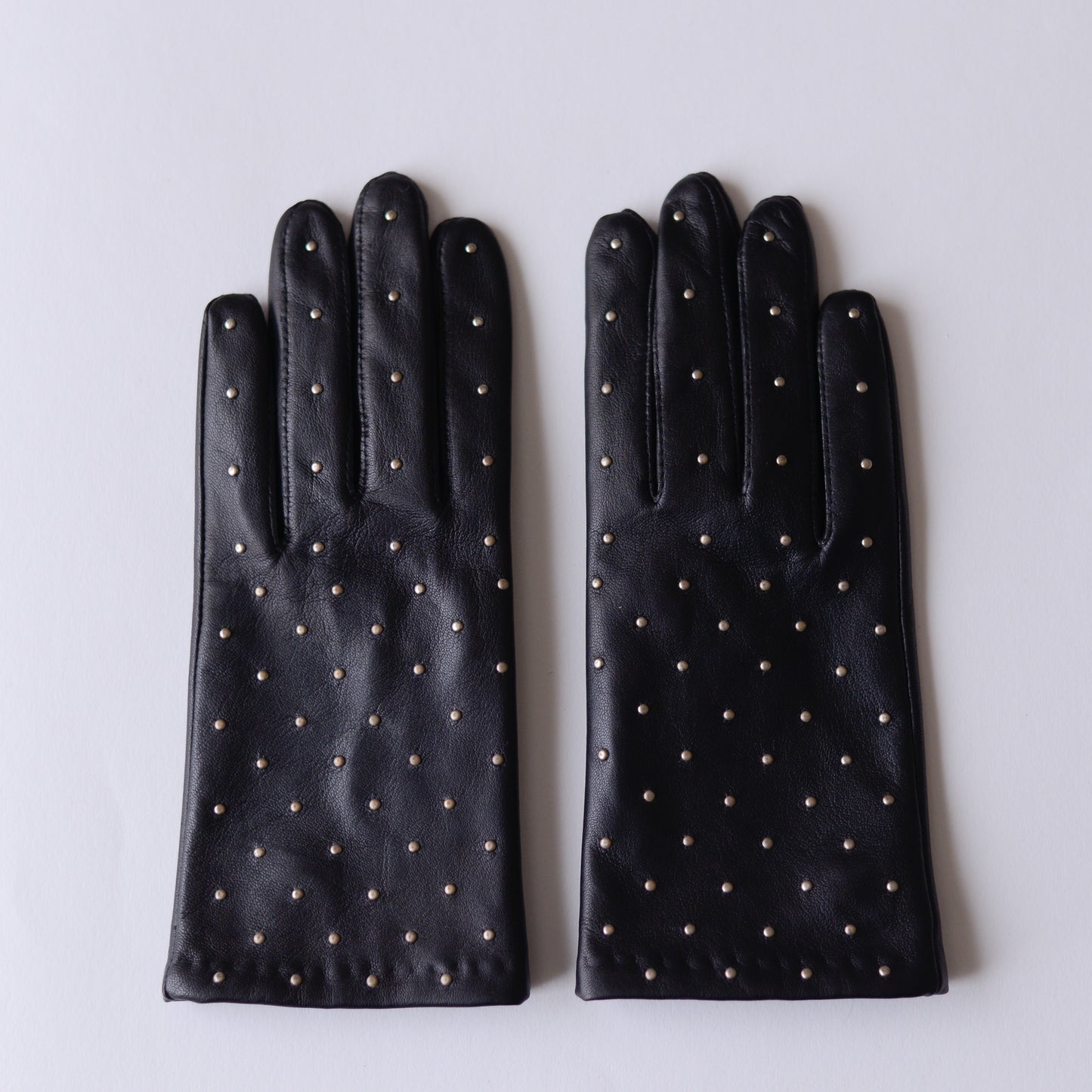 Silk-lined studded leather gloves in Black
