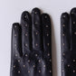 Silk-lined studded leather gloves in Black