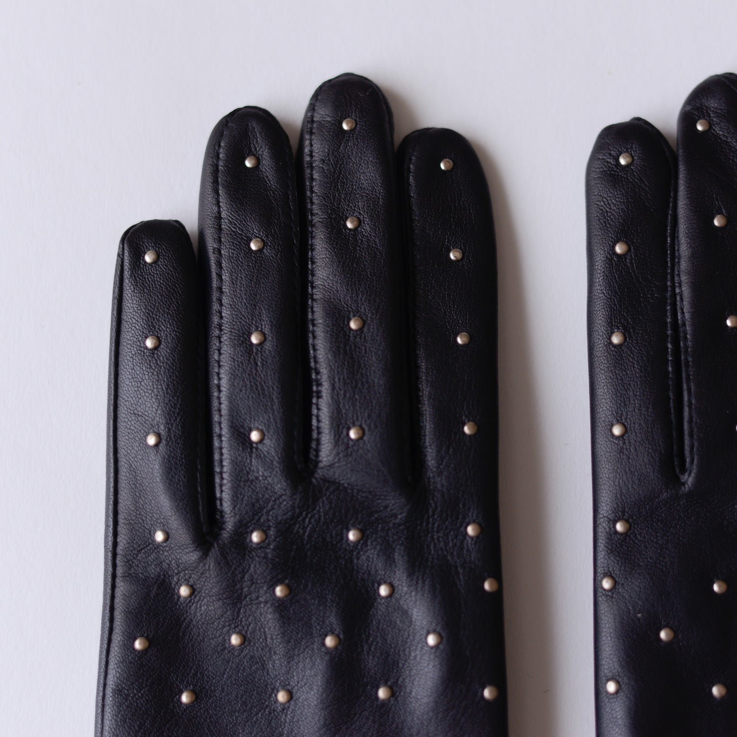 Silk-lined studded leather gloves in Black
