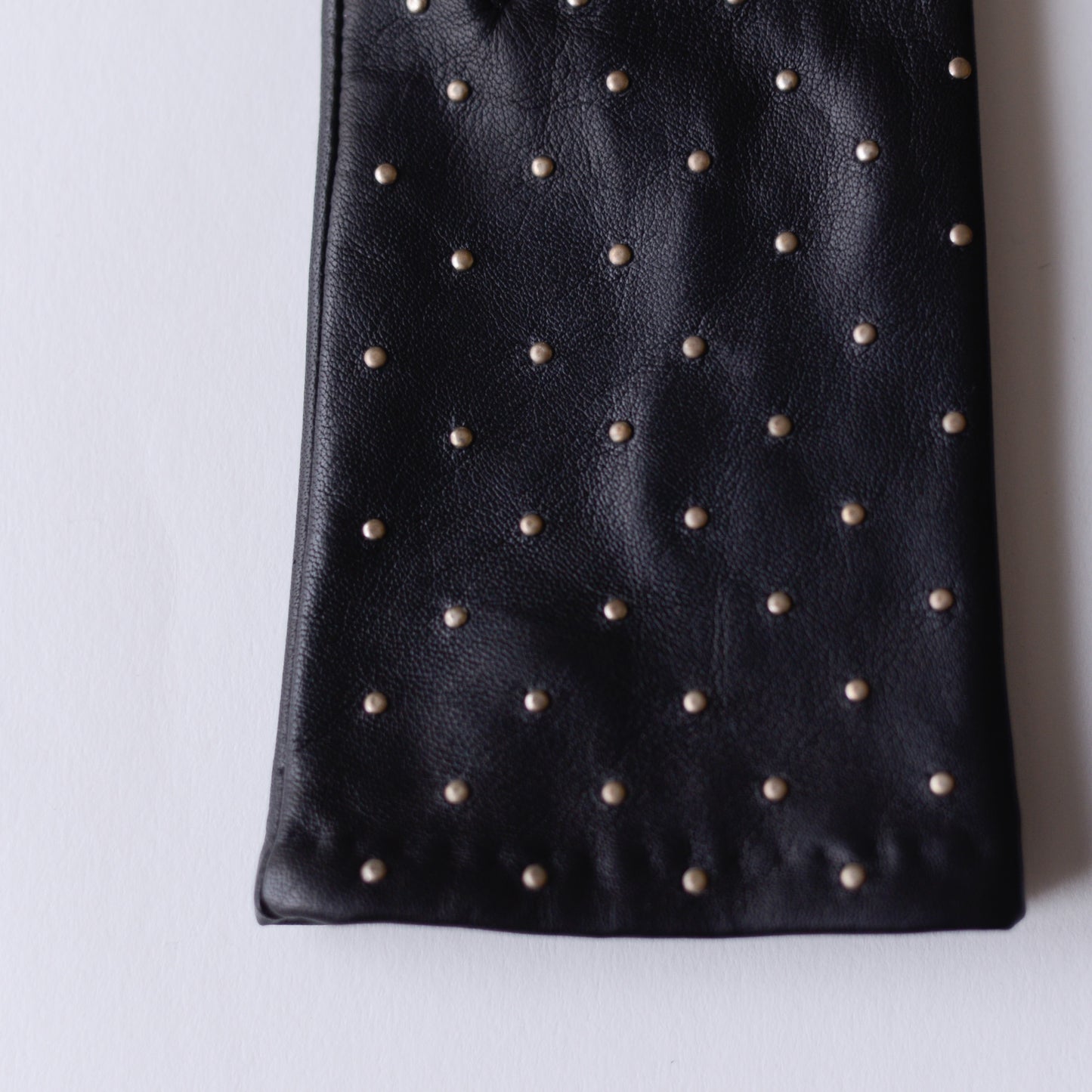 Silk-lined studded leather gloves in Black